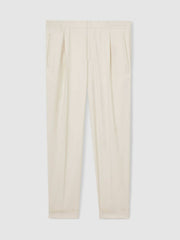 Relaxed-Fit Pleated Tapered Trousers in Ecru