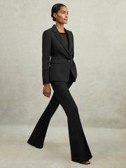 Wool-Blend Tailored Flared Suit Trousers in Black