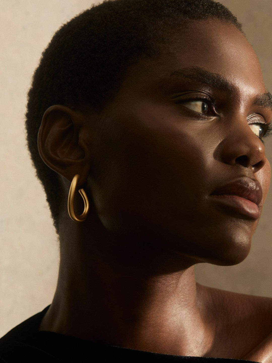Wave Hoop Earrings in Gold Tone