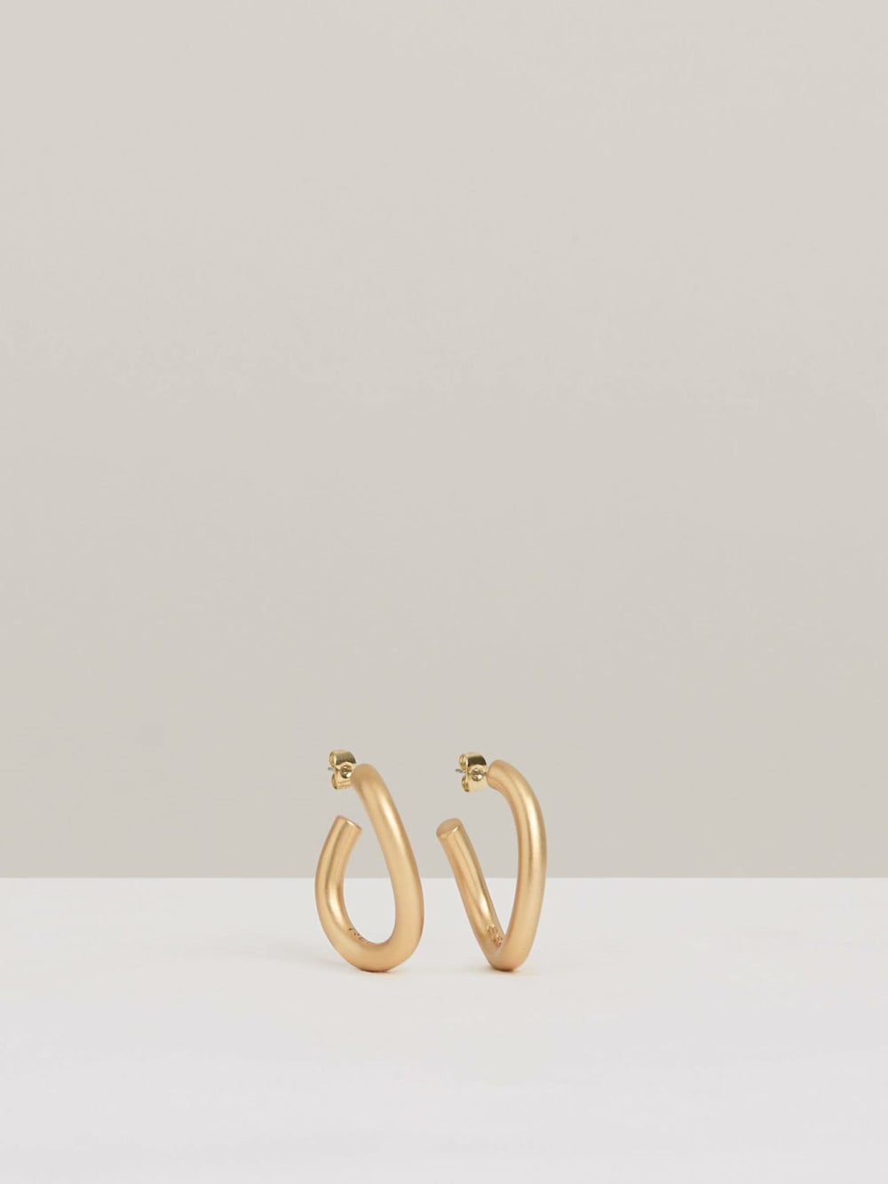 Wave Hoop Earrings in Gold Tone