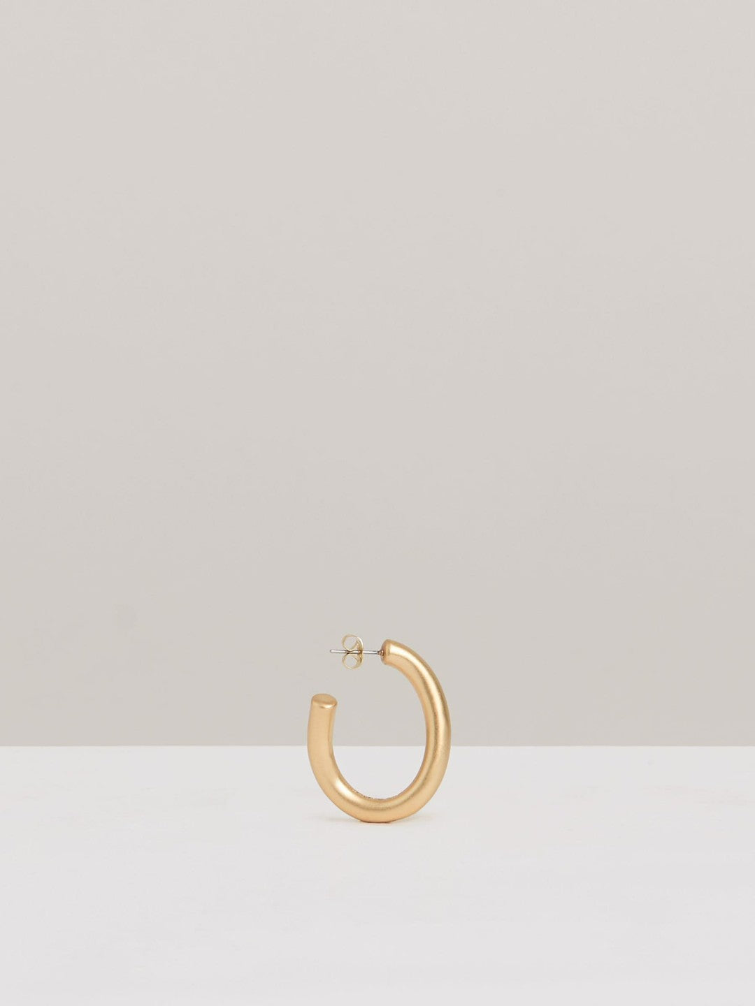 Wave Hoop Earrings in Gold Tone