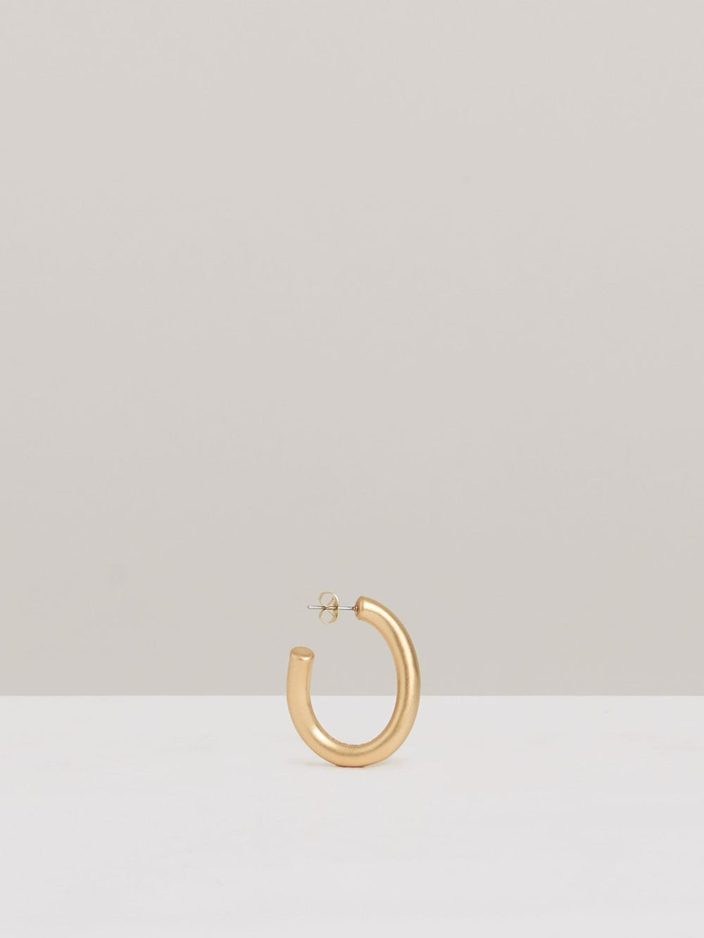 Wave Hoop Earrings in Gold Tone