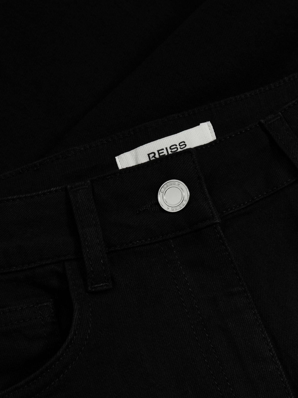 Petite Mid-Rise Flared Jeans in Black