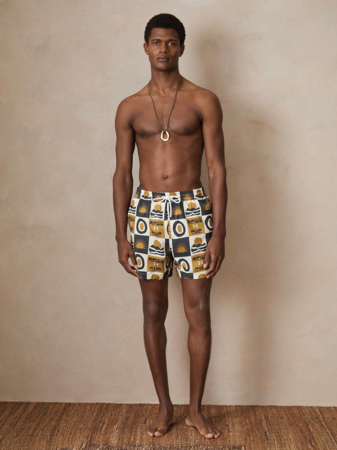 | Ché Sunset-Print Swim Shorts in Olive Green