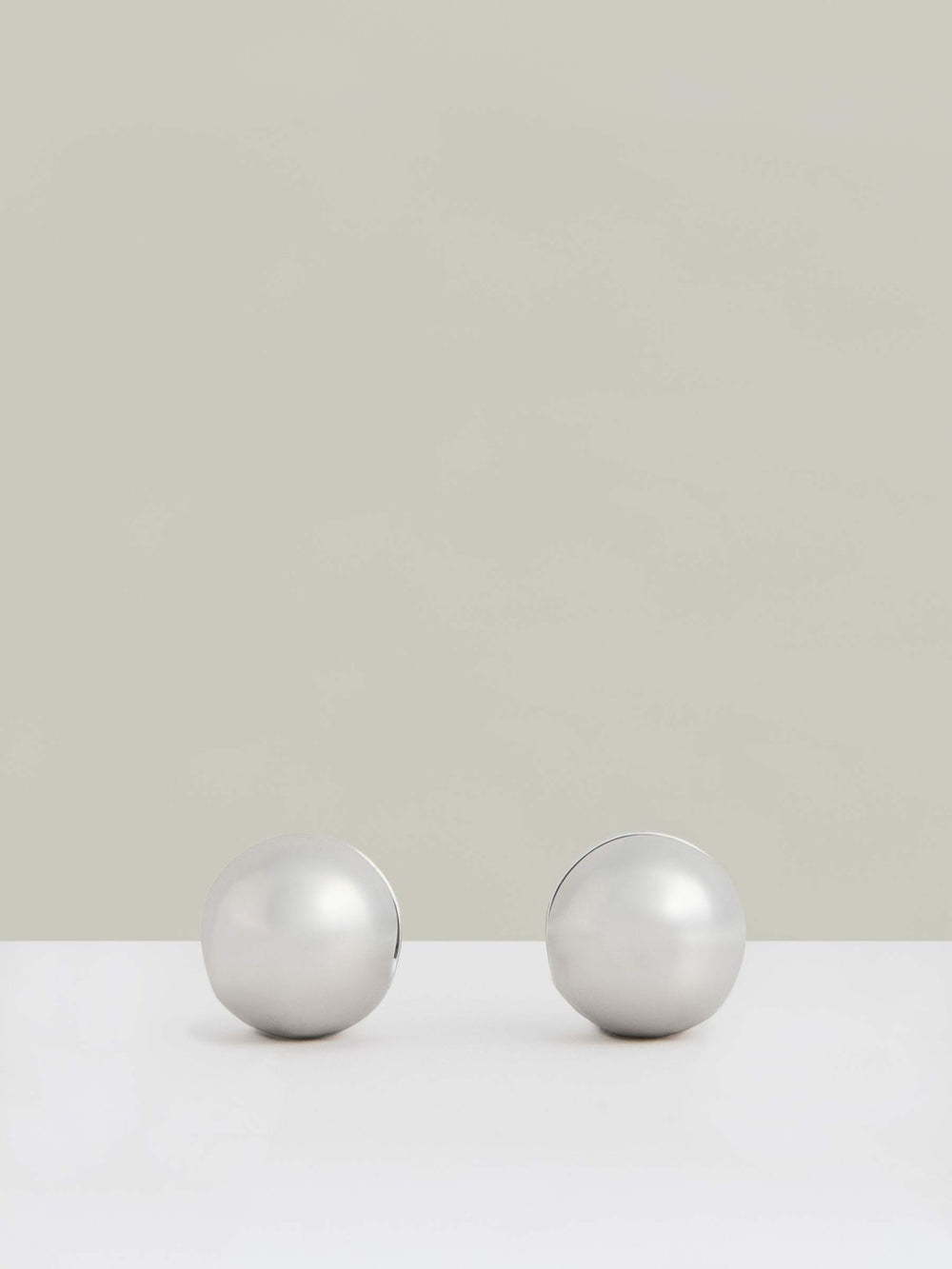 Polished Ball Huggie Earrings in Silver Tone