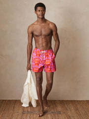 | Ché Sunset-Print Swim Shorts in Orange/Pink