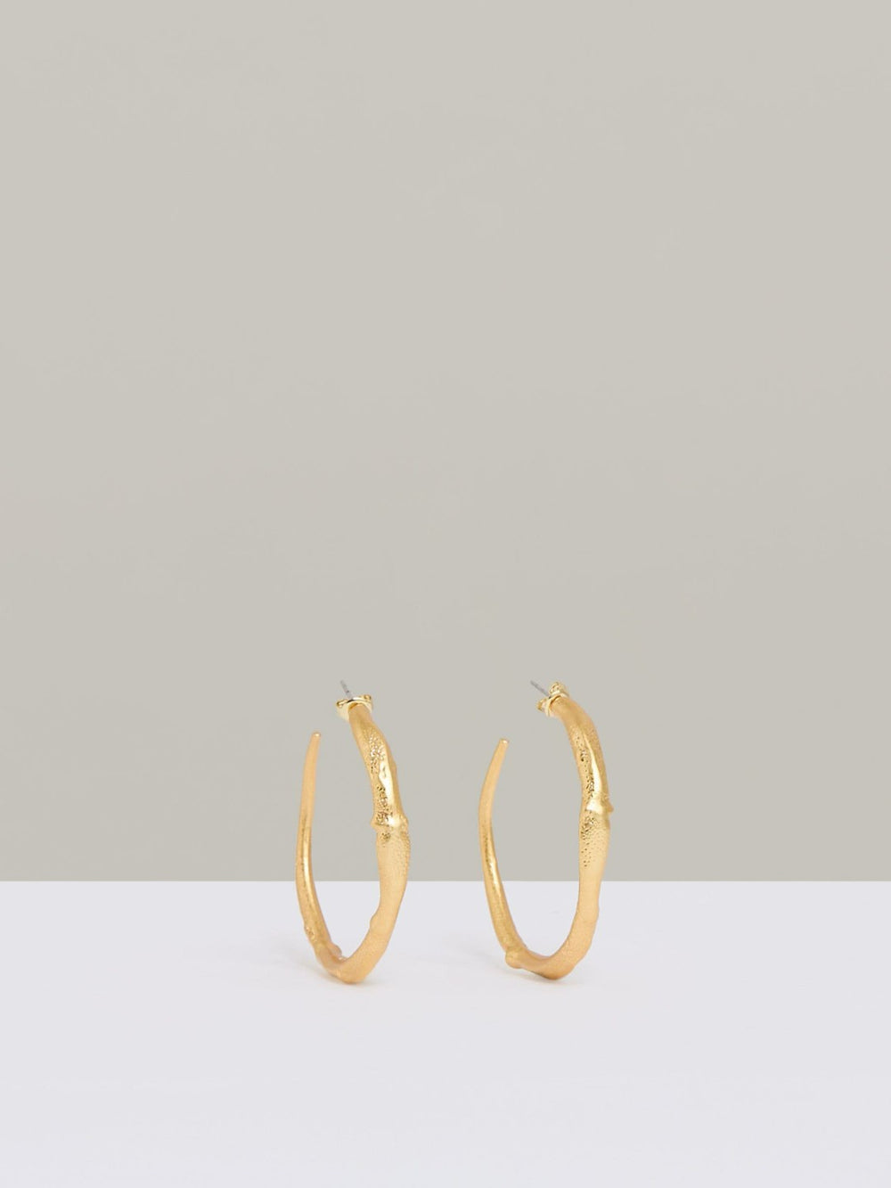 Molten Hoop Earrings in Gold Tone