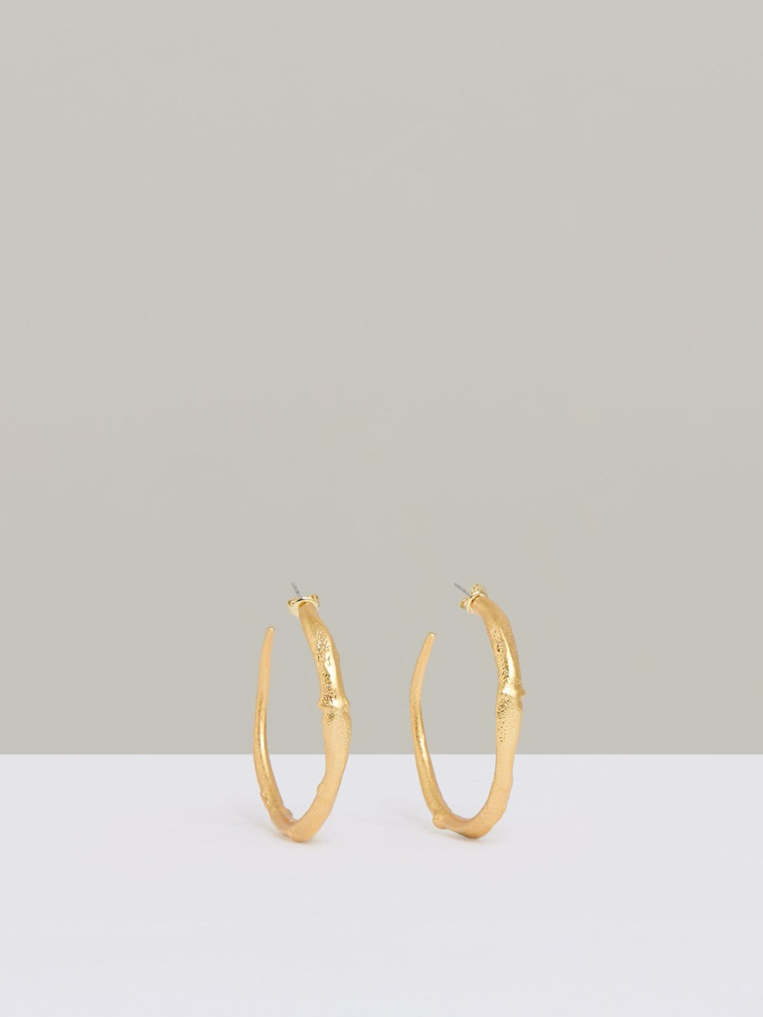 Molten Hoop Earrings in Gold Tone