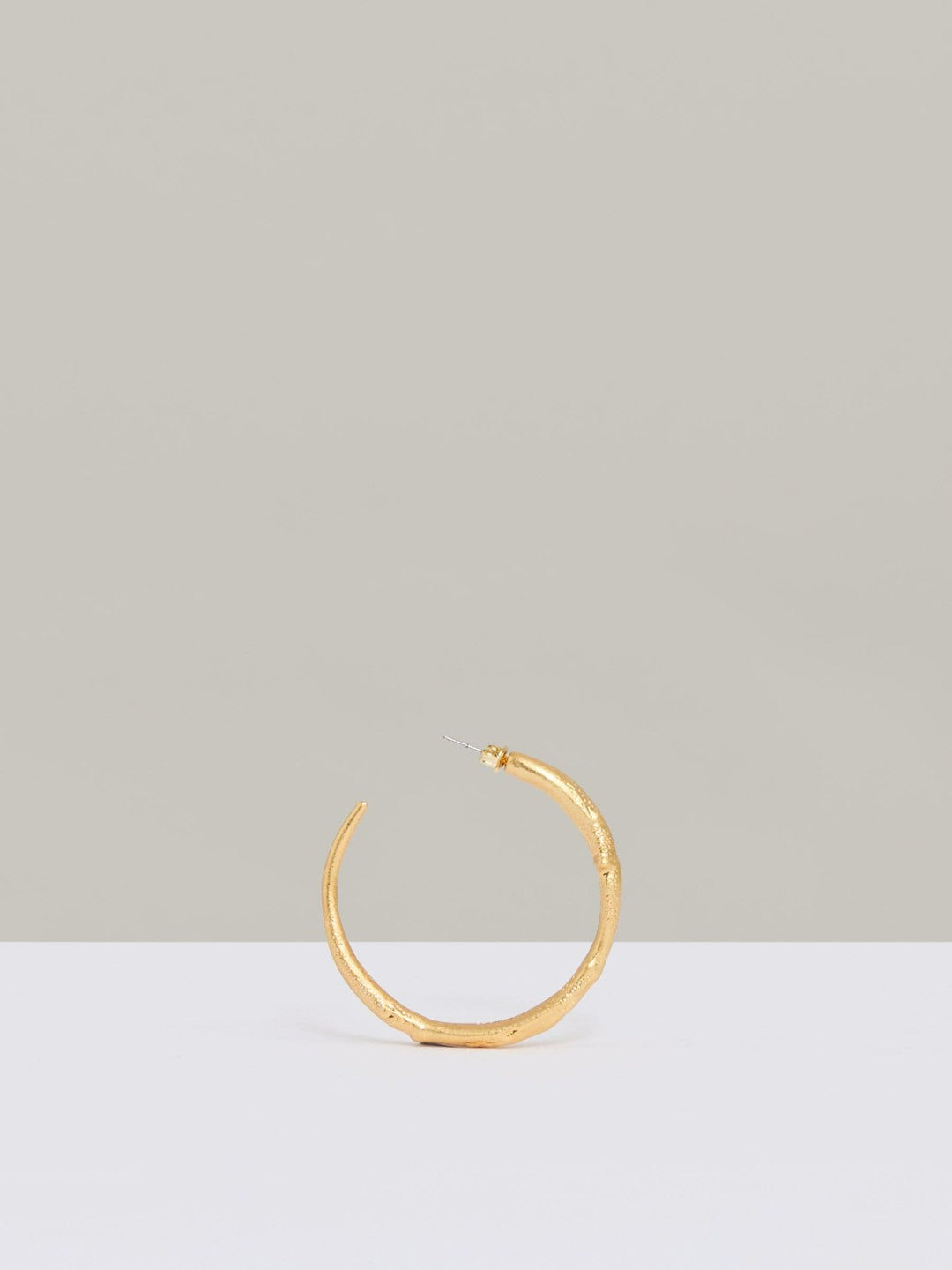 Molten Hoop Earrings in Gold Tone