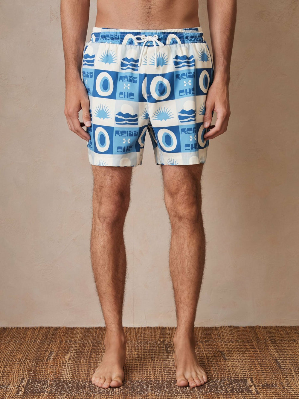 | Ché Sunset-Print Swim Shorts in Blue Multi