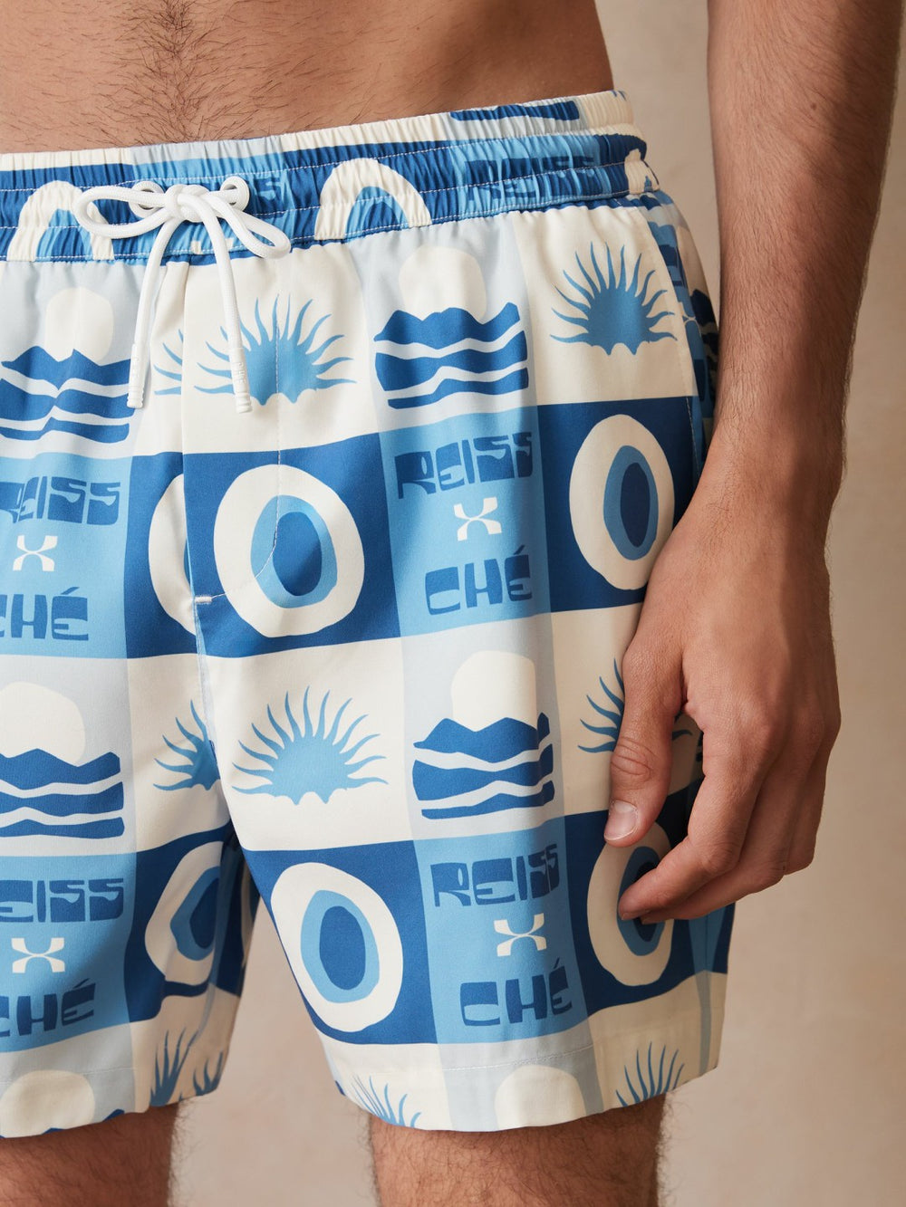 | Ché Sunset-Print Swim Shorts in Blue Multi