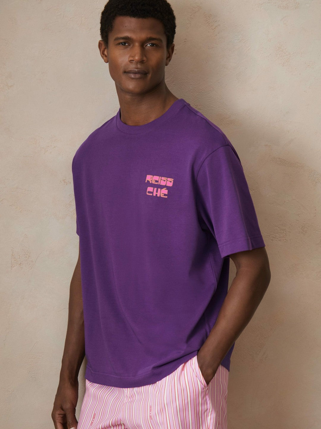 | Ché Cotton Palm-Print T-Shirt in Purple