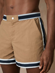 | Ché Stripe-Trim Swim Shorts in Camel