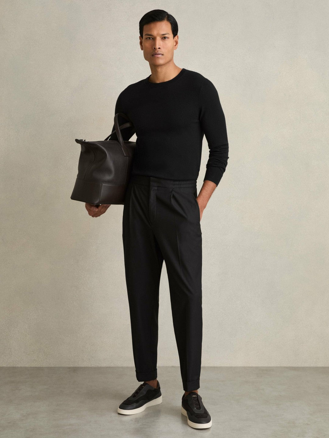 Relaxed-Fit Pleated Tapered Trousers in Black