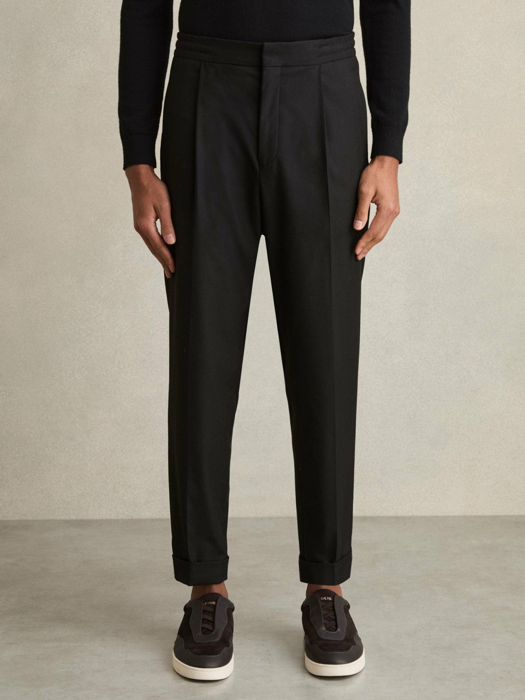 Relaxed-Fit Pleated Tapered Trousers in Black
