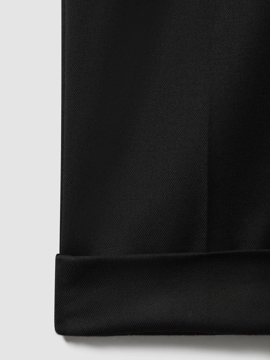 Relaxed-Fit Pleated Tapered Trousers in Black