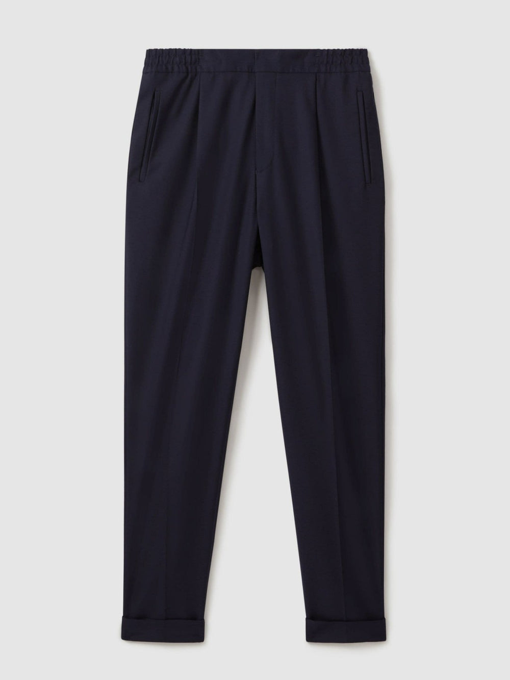Relaxed-Fit Pleated Tapered Trousers in Navy
