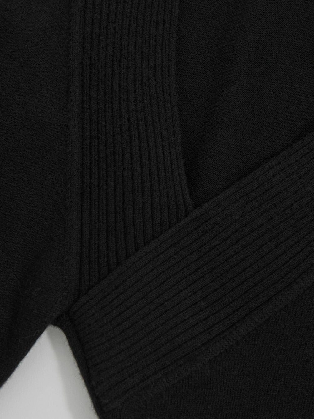 Wool-Blend Asymmetric Knit Top in Black